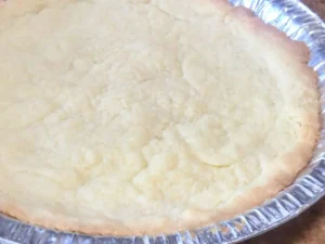 Milk tart pastry base in the oven after 10 minutes of baking
