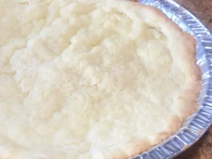 Traditional Milk tart pastry base baking in the oven after 5 minutes