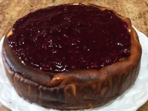 Classic German cheesecake topped with mixed berry sauce