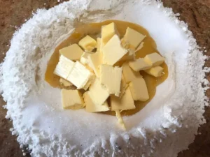 Cold butter cubes added to Mürbeteig dough
