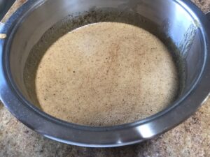 Warm syrup mixture bubbling after adding bicarbonate of soda and water for Syrupkuchen dough.