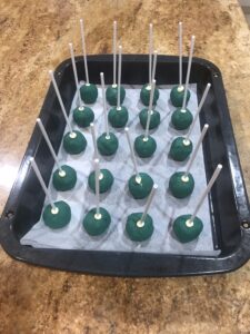 Cake Pops - Dip the sticks in chocolate and insert