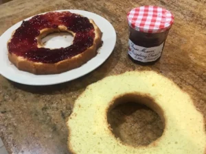 Frankfurter Kranz cake sliced with jam spread on bottom layer