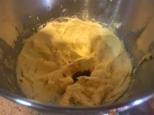 Adding vanilla essence to the cake batter