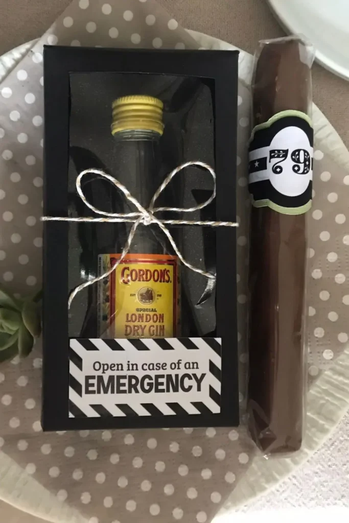 “In Case of Emergency” mini alcohol bottles displayed in a black gift box for party favours.