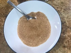 Mixing cinnamon and sugar together for the apple cinnamon swirl loaf cake
