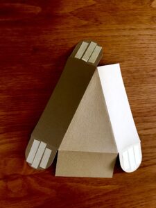 Fold and attach tabs using double sided tape