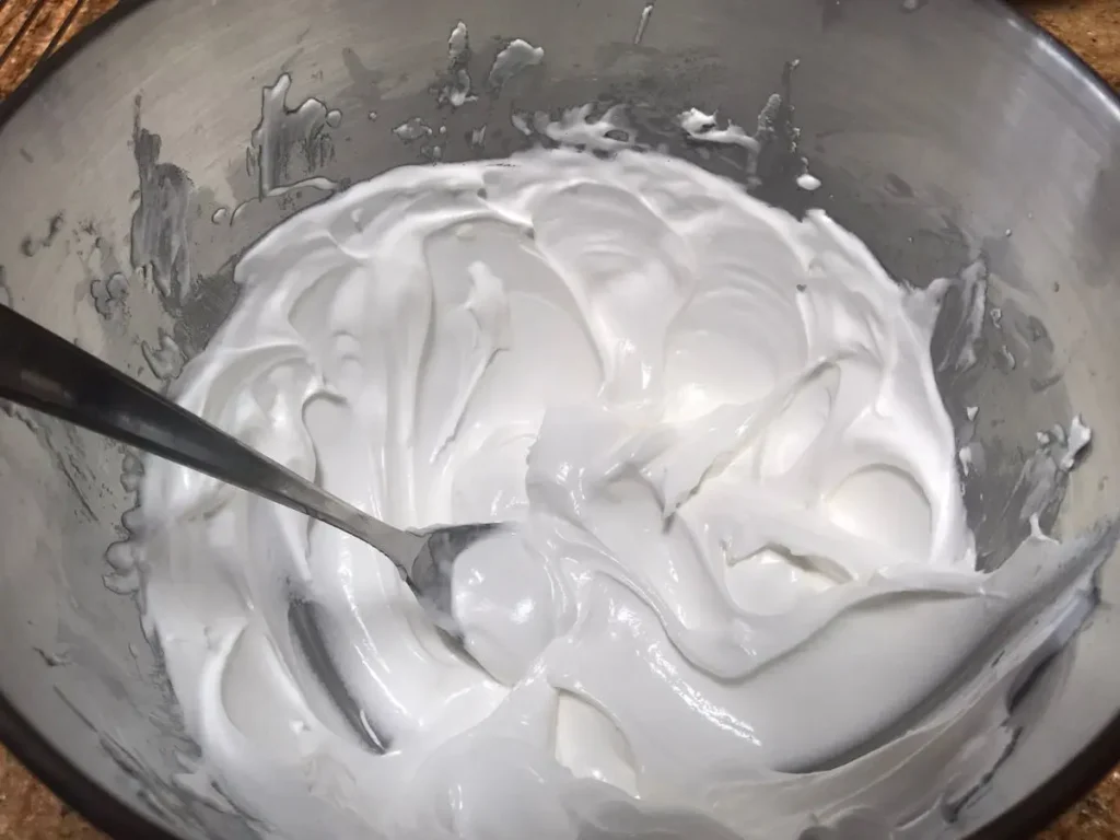 Royal icing being prepared for Christmas wreath cake