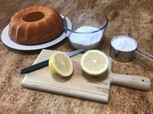 Yoghurt cake with ingredients for lemon glaze