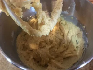 Mixing old fashioned banana bread batter in bowl