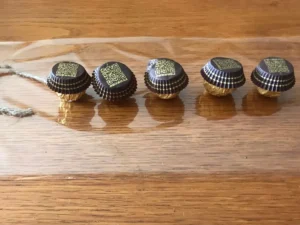 Ferrero Rocher chocolates lined up on a piece of cellophane