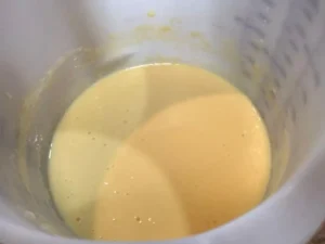 Eggs and Buttermilk mixed together for Easter Chocolate Cake batter