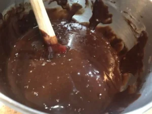 Chocolate mixture stirred in a bowl for the Easter Chocolate Cake batter.
