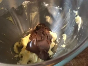 Nutella added to softened butter and icing sugar