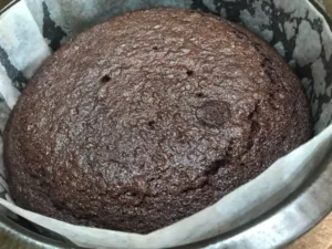 Baked Chocolate cake in a lined cake tin