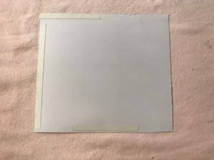 The back of the sheet with tape for crafting a easter carrot favour