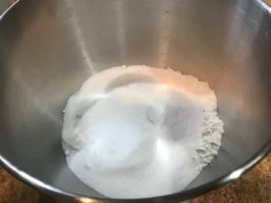 Dry ingredients mixed in a large bowl for chocolate cake