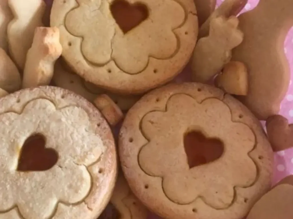 German tea biscuits with heart cut-out centres, lightly golden and stacked together