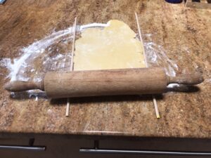 German Tea Biscuits - On a floured surface, roll out the dough using dowels for uniform thickness.