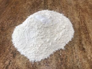 German Tea buiscuits - Flour and baking powder on a clean surface