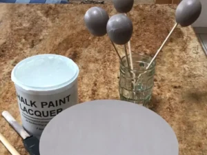 Sealing painted eggshells and wooden circle with clear Annie Sloan Chalk Paint Lacquer