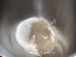 Mixing bowl with flour, sugar, and instant yeast