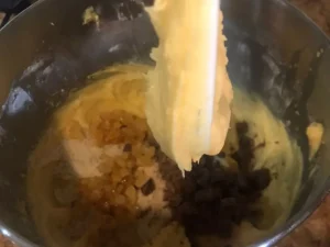 Adding almonds chocolate and mixed peel to Ottilienkuchen batter