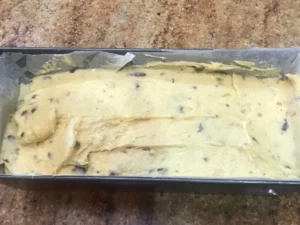Ottilienkuchen batter spread in loaf tin before baking