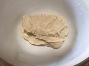 Smooth, stretchy cinnamon roll dough after kneading.