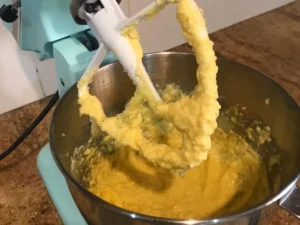Eggs being mixed into cupcake batter