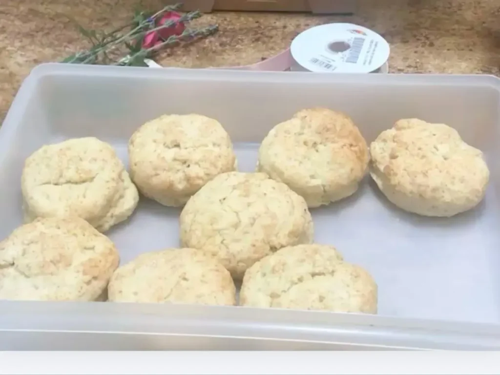 A batch of freshly baked butter scones with a light, golden finish.