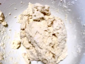 Mixing butter scone dough in a bowl