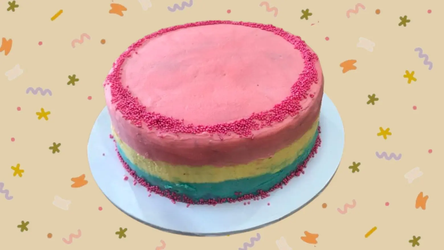 Colourful chocolate birthday cake with rainbow buttercream layers