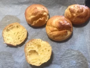 Choux pastry cream puffs with hollow centres, perfect for filling with pastry cream or whipped cream.