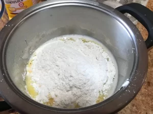Flour added to melted butter and water in a saucepan for choux pastry.