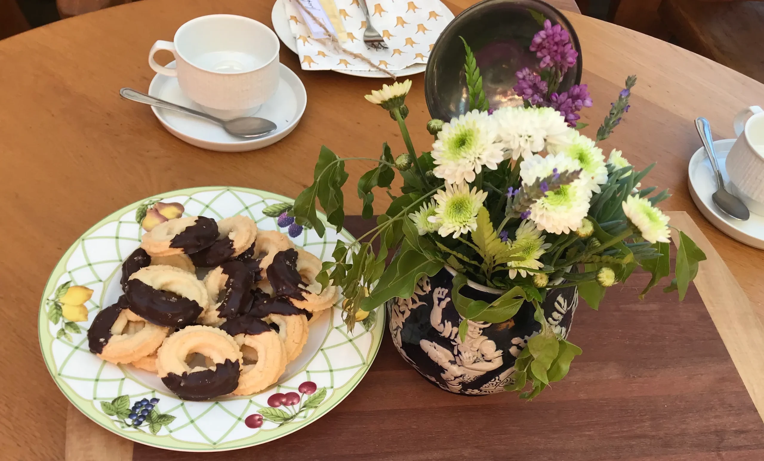 Spritzgebäck biscuits dipped in chocolate for tea for milestone birthday celebration.