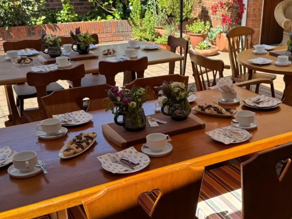 Milestone birthday table décor with place settings and flowers