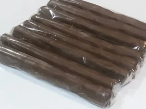 Chocolate cigars wrapped in clear plastic, ready to be turned into party favours