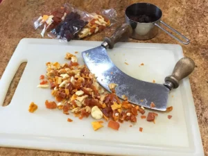Russian squares recipe chopped mixed dried fruit on a cutting board