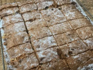 Russian squares recipe baked and cut into neat squares in the tin