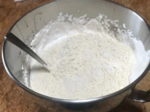 Flour being folded into Pfefferkuchen batter