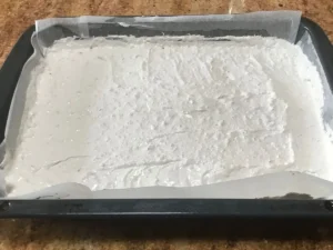 Baked Pfefferkuchen sheet cake cooling before icing