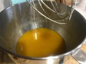 Transfer butter oil and sugar mixture to the bowl of a stand mixer
