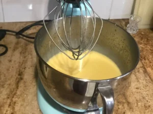 Eggs and buttermilk whisked into the wet ingredients for buttermilk bran rusk recipe