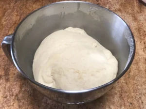 Butterkuchen dough resting in a mixing bowl after knead