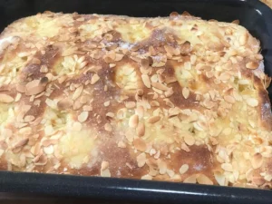 Freshly baked Butterkuchen topped with sliced almonds and caramelised butter