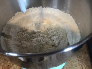 Milk mixture added to Flour mixture before kneading.