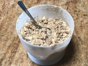 Oats and apple breakfast cake batter in mixing bowl