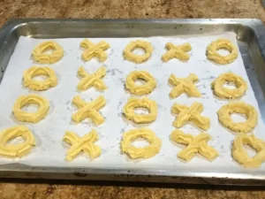 Piped Spritzgebäck cookie dough on baking tray ready for baking