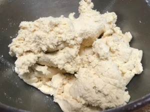 Flour mixture being added to the browned butter dough